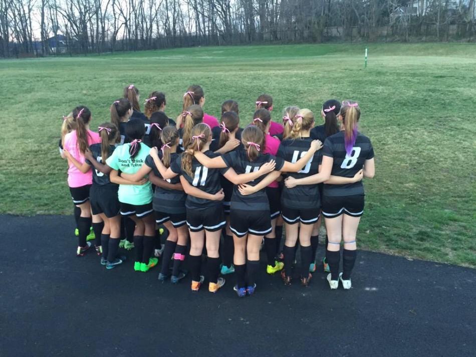 The+Girls+Soccer+Team+wore+pink+ribbons+in+remembrance+of+Madison+Small.