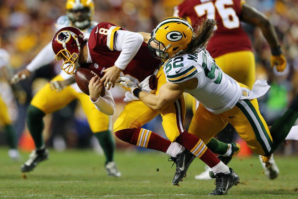 LANDOVER, MD - JANUARY 10: Inside linebacker Clay Matthews #52 of the Green Bay Packers sacks quarterback Kirk Cousins #8 of the Washington Redskins in the first quarter during the NFC Wild Card Playoff game at FedExField on January 10, 2016 in Landover, Maryland. (Photo by Elsa/Getty Images)