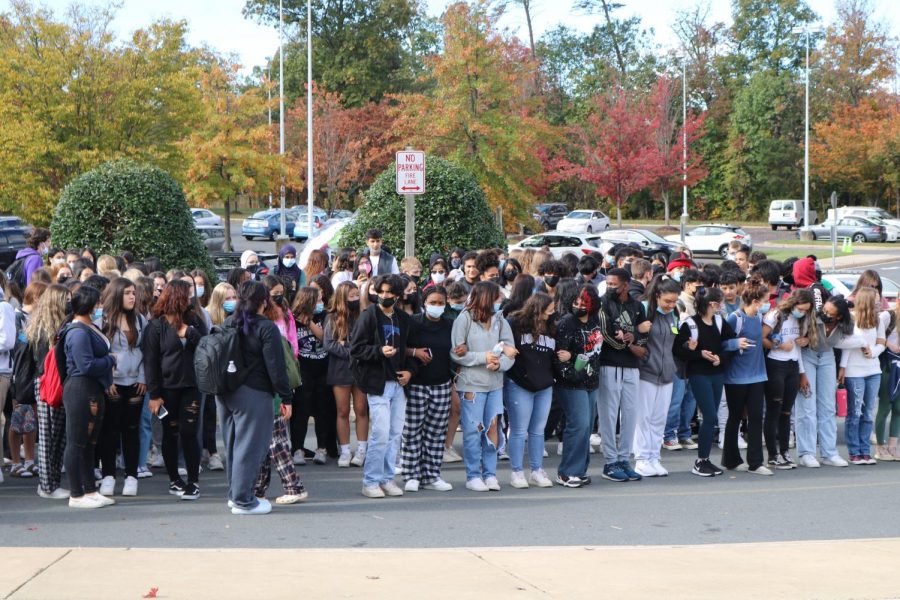 Locking hands in solidarity, students chanted to show support for sexual assault victims.