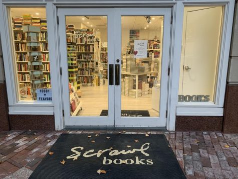 The doors to Scrawl Books open up to an awesome supply of books for customers to buy.
