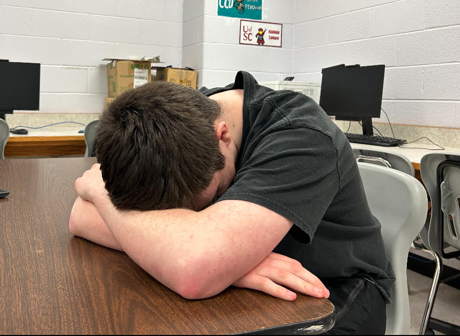 A student hangs his head in shame as he is faced with senioritis.