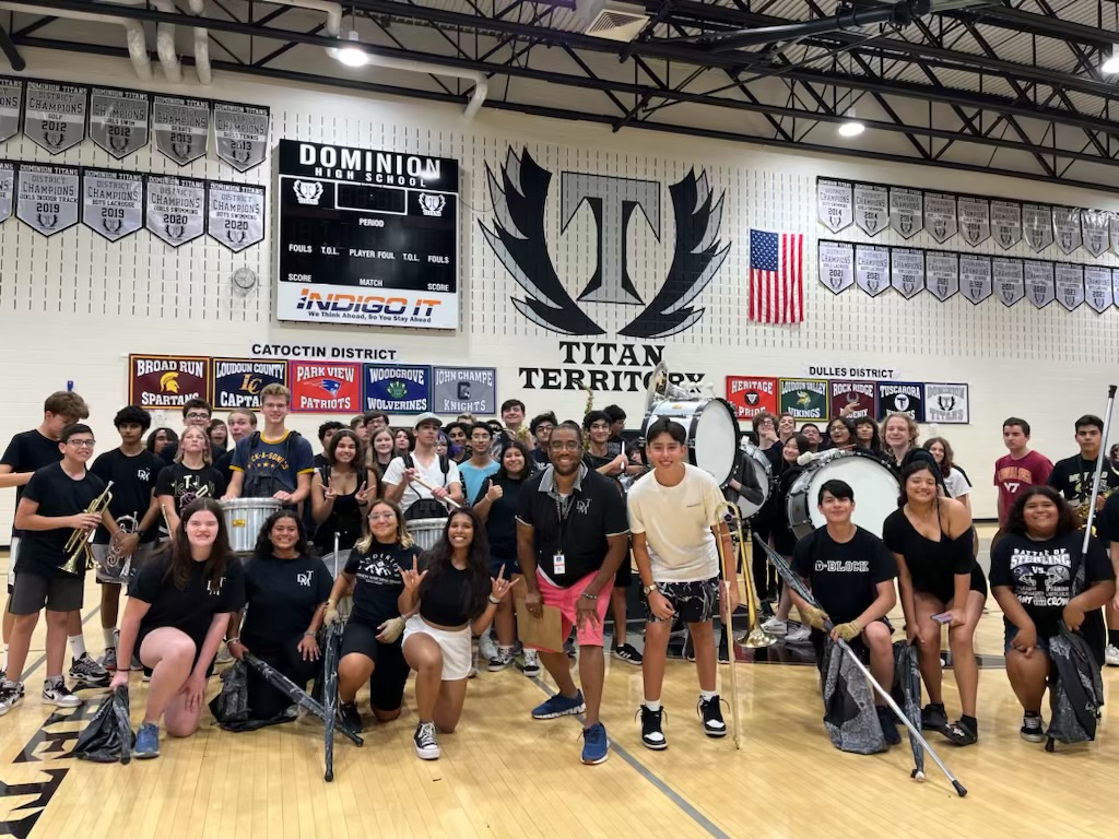 Pictured is Mr. English in dead center, surrounded by the band after performing during the pep rally. 