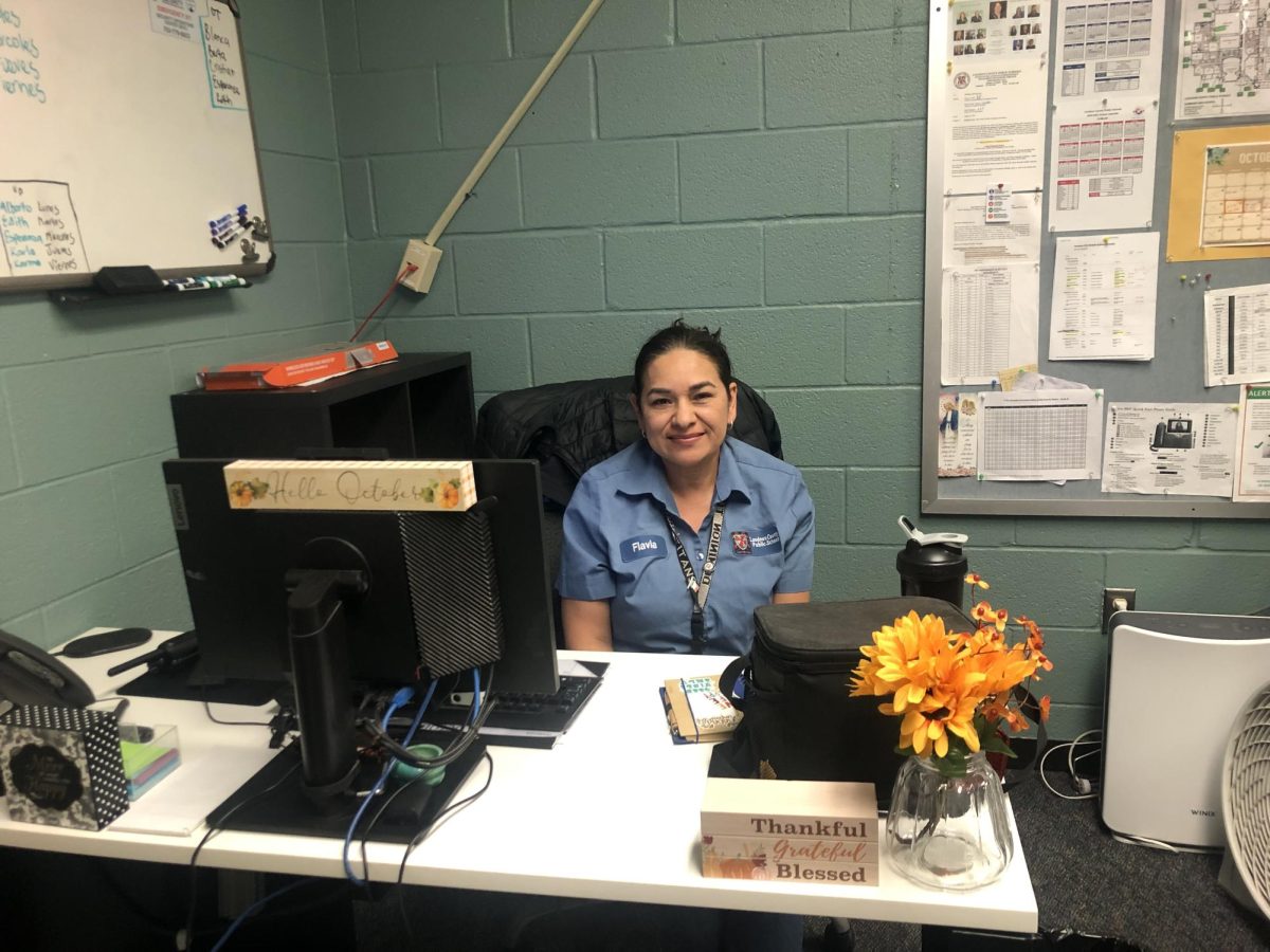 Flavia Medina can be found in her office, left of the cafeteria and down the hall. 