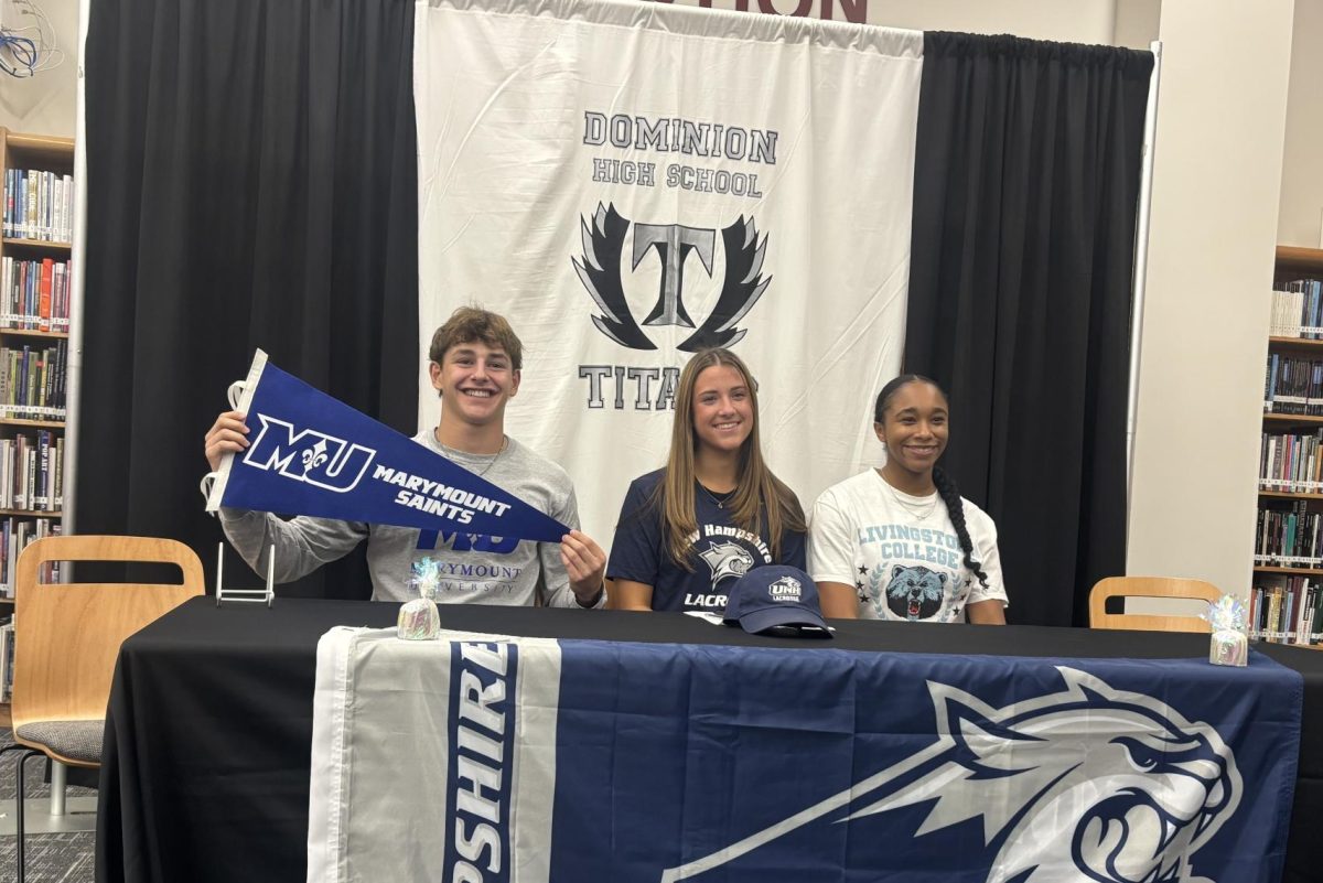 The three athletes at signing day after having signed off to play at the next level.